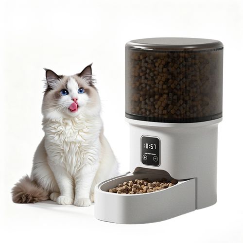 Smart pet feeder LCD display showing programmable meal schedule — Nuzzle automatic feeder